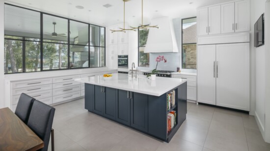 Big windows offer a view to the backyard in this Hunters Trail home, designed by architect Donna Kacmar, principal of Architect Works. Photo by Benjamin Hill