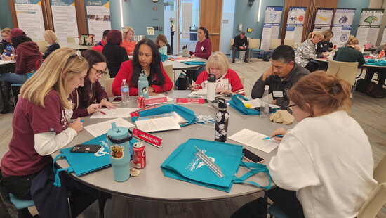 A group working as a principal on Education Day.