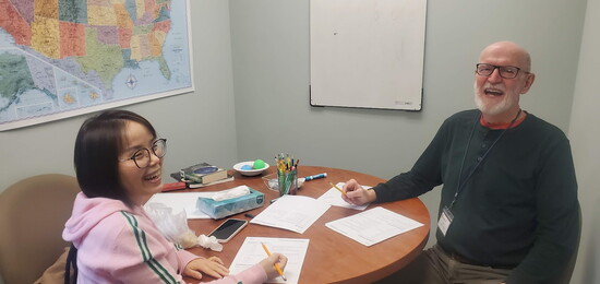 Tutor Frank Culbertson and his student share laughter at the Learning Lab PC: Learning Lab