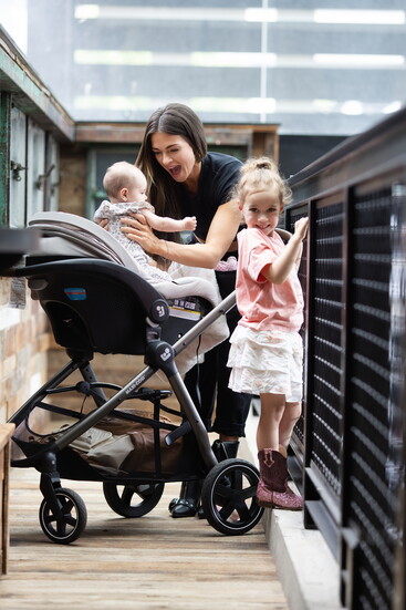 Modern mom, Kirsten and her daughters stroll along the Potomac