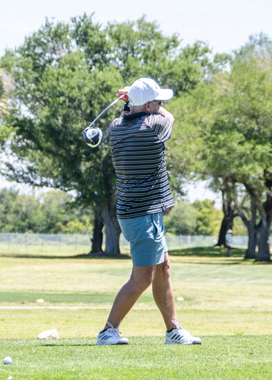 A golfer takes a swing at Lake Venice Golf Club. (Photo by Jessie Marie Glantz)