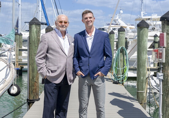 Jim Boldt and Dr. Chris Roberts stand on the dock at the Venice Yacht Club. (Photo by Brian Glantz-1st Glantz Media)