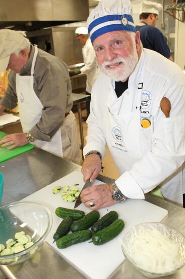 Tim Wynkrop Roswell preps cucumbers for a salad