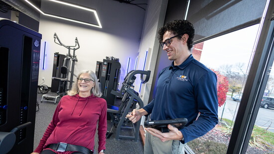 Trainer Ransom Wilkes-Davis works with client Ann during a personalized strength training session.