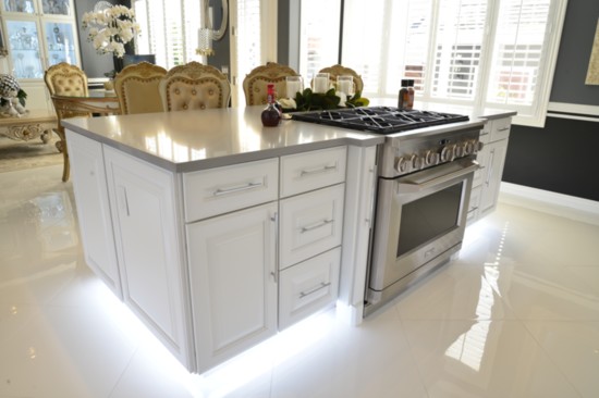 Even the island lights up and showcases the new commercial-grade gas stove.