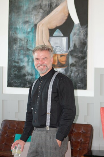 Guy Sanders at Oben in Front of One of His Paintings