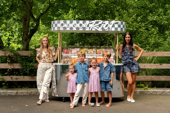 Jessica, left, Lana, right, and their kids at the Candy Riot cart. Photo by TK.