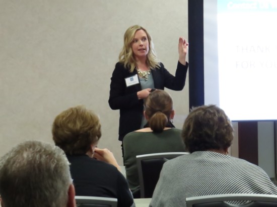 Certified Financial Advisor Lauren Robbins leads a seminar for parents on how to teach children financial literacy.