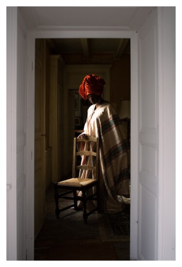 A photo from "The Lady and the Chair" by Woman of Westport Lewis Derogene, a series about carrying the burden of Black womanhood.  