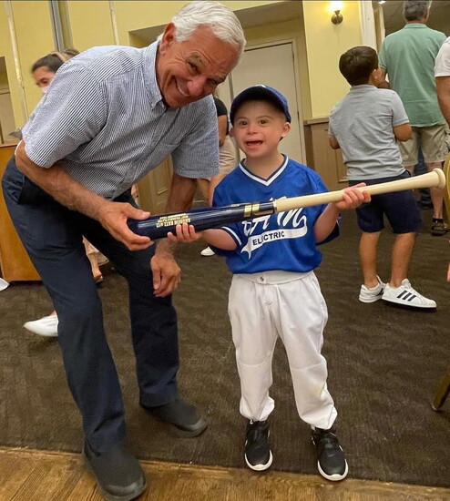 Major League Manager and Player presents Andy Katz with an autographed bat.