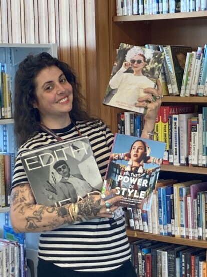 Norman Public Library East library associate Lauren Panichelli shows her favorite books on style.