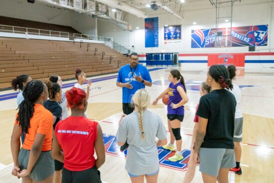 Coach Key instructs his players during a practice.