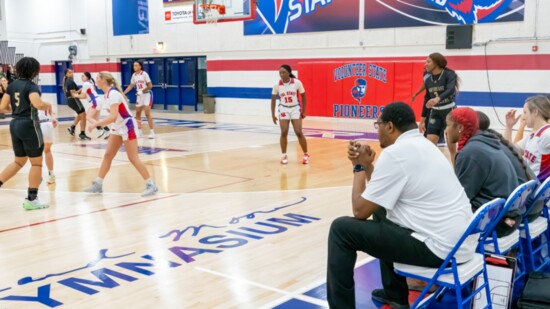 Coach Key watches his players in game play.