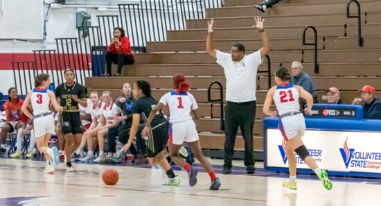 Coach Key shouts out instructions to his players.