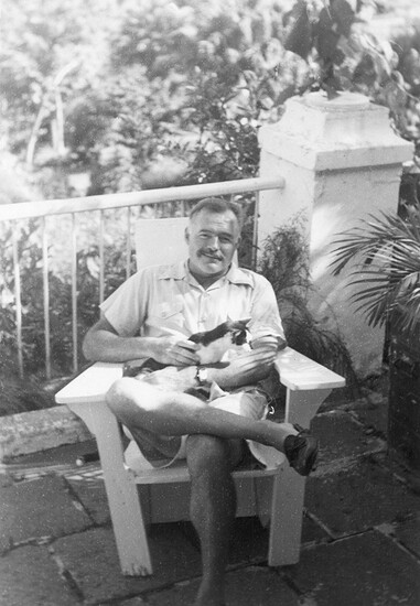 Ernest Hemingway with a cat in Cuba