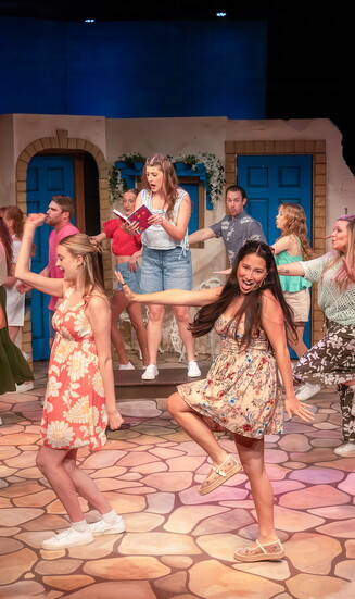 Costumes and lighting are key to this scene from Mamma Mia.