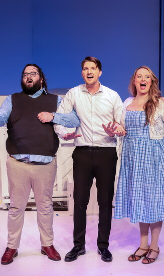 Simple setting but clever staging make this scene from Merrily We Roll Along work.