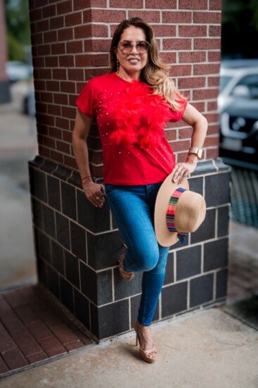 Fun red t-shirt embellished with 3D red flowers and pearl accents. Comfortable yet chic and trendy.