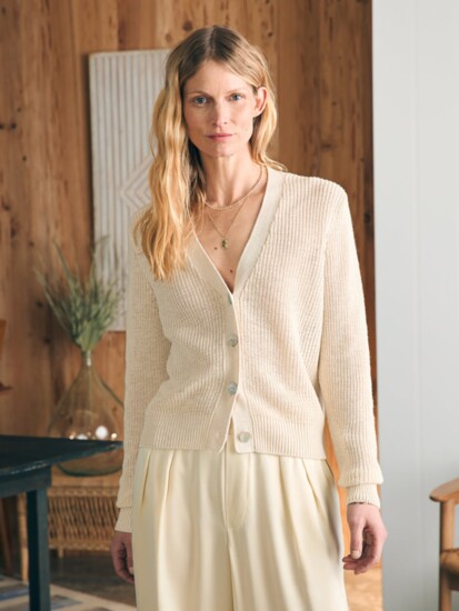 This charming cardigan is knit in an airy linen cotton blend. Ideal for layering. Beautiful with a slouchy, oversized fit. 