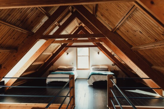 The open loft space includes additional sleeping space