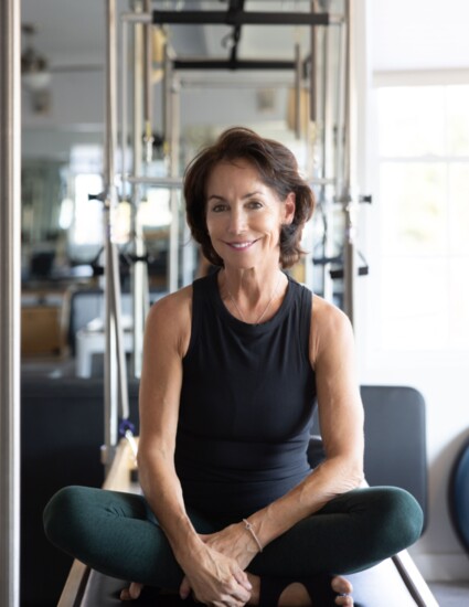 Sharon in studio on a reformer