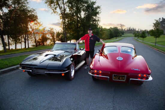 Collector Mike Kidd poses with two of his prized C2 Corvettes.