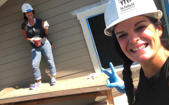 Estate Properties agents Lisa Lopez and Mimi Alonso snap a selfie while volunteering with Habitat for Humanity.