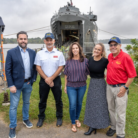 Ashton Jennings, Lisa Cole and Natalie Lankster pose with LST-325 Captain John Vaughn and crew member Ken Rupp.