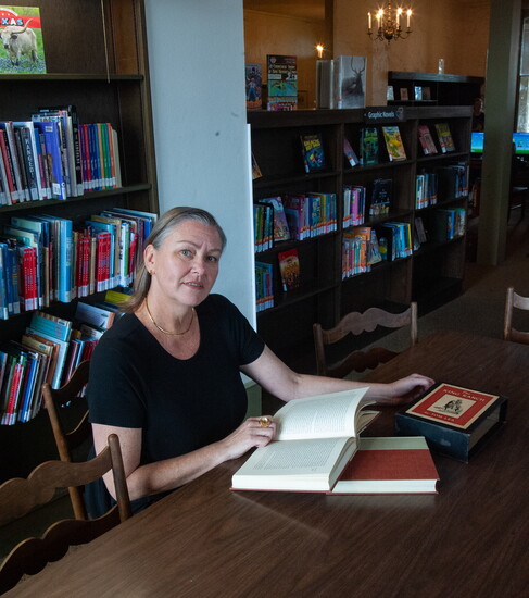 Erika Caputo keeps a collection of historic documents and books in her office