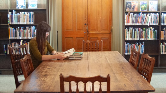 Resident Amy Heimann uses one of the many cozy spaces for reading and study