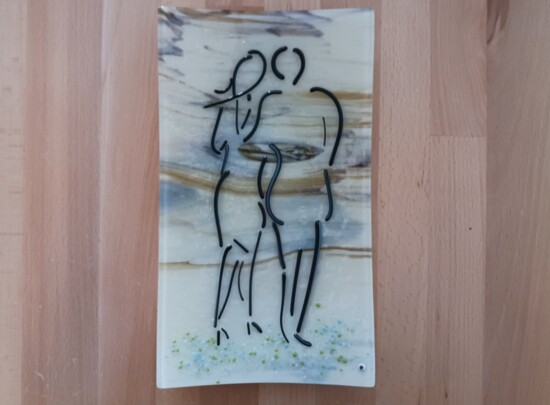 A glass creation featuring a couple.