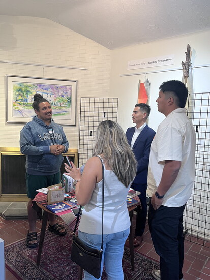 Jesus Walle shares about his sketchbooks at a recent event for Association of Latino Professionals for America at High Road