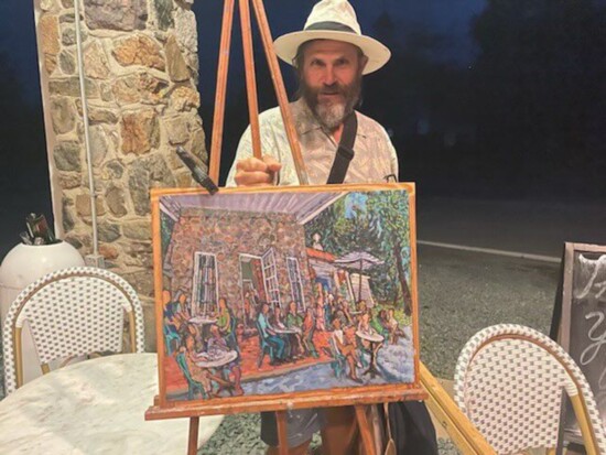 Randy Smith with a painting. Photo Credit: Ashley Sieg.