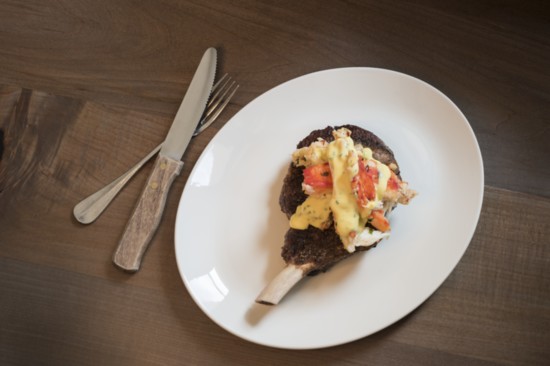 Prime bone-in rib-eye with king crab Oscar and classic bearnaise sauce at Lincoln