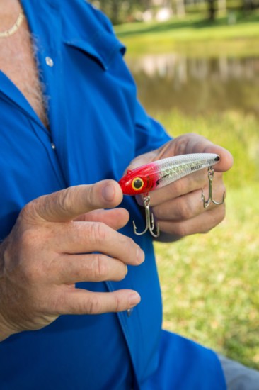 Chris shows off one of his top water plug lures.