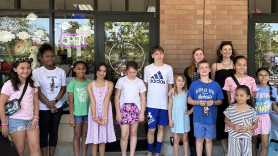 Jenny Kuten, owner of The Woodland Express, with the children who participated in the Kid-Preneur Pop-Up Shop.