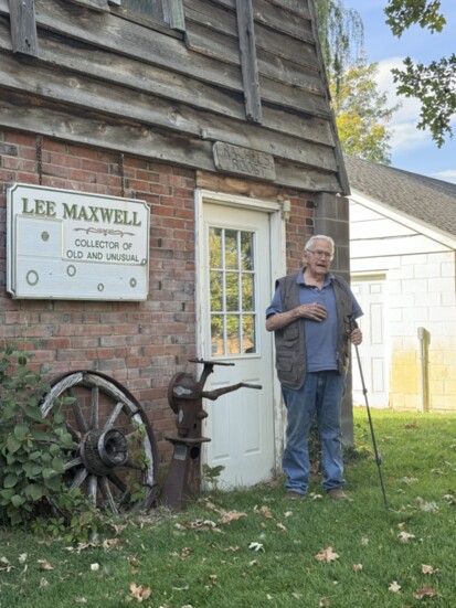 Lee Maxwell outside his museum that may look like an adorable little cottage on the outside, but has so much more going on inside!