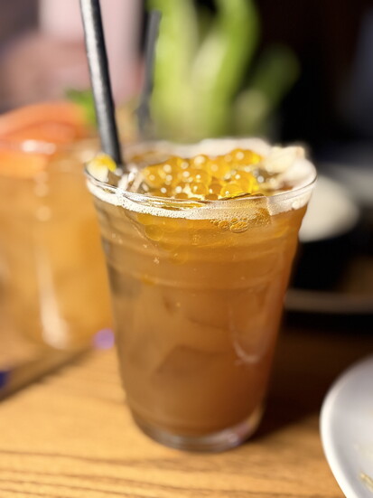 Mango Bubble Tease: lemon, peach, and vanilla tea with Boba. Kid-friendly.