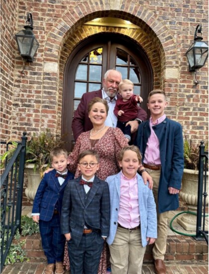 Artist Jan Parker, center, with her husband Benny and their five grandsons