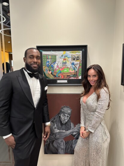 Snyder with her work and friend Kam Chancellor