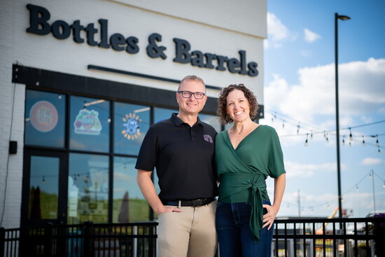 Jimmy Ellsworth and his wife, Becky, welcome guests outside Bottles & Barrels, Elkhorn’s community-centered tasting and retail destination.