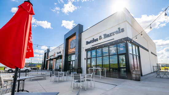 Locals sample bourbon, wine, craft beer, and cocktails at Bottles & Barrels, Elkhorn’s community-focused tasting and retail spot.