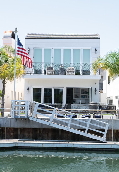 Clean lines and an unadorned facade ensure the picturesque Naples canal views remain the focal point of this coastal contemporary home.
