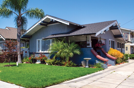 A Craftsman bungalow located in historic Craftsman Village, showcasing the popular home style’s characteristic low-pitched gables and deep overhanging eaves.