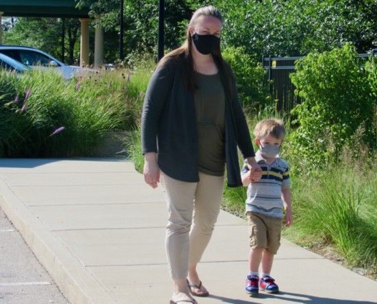 Melanie Detloff walks with son Max to start the school day.