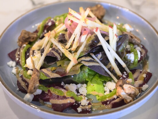 The Roasted Beet Salad is just one of the beloved vegan dishes at the restaurant. 