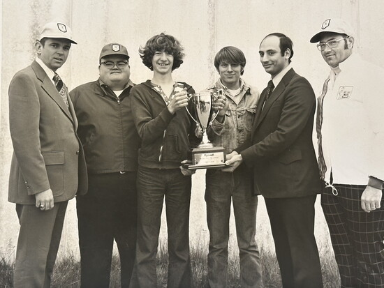 An archived photo of Ed Fisher (center) at the May 1974 state of Iowa Plymouth Troubleshooting Contest. (Courtesy pic by Ed Fisher)