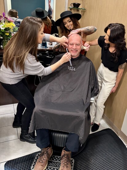 Owner Jeff Eggert receiving expert, attentive service from (L-R) Emily, Ashtyn, and Erica