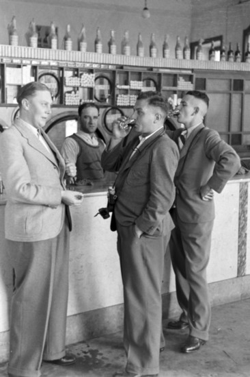 Men in a 1930's drink bar