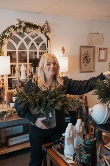 Jennifer, adds finishing touches to her displays.